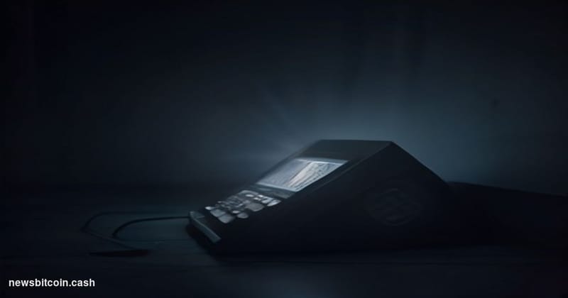 Cinematic photorealistic editorial photograph of a Coldcard hardware wallet device — matte black, compact, with its distincti